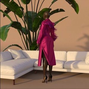 Silky magenta duster in a size M. Has a low v-neckline, and button-down detail.